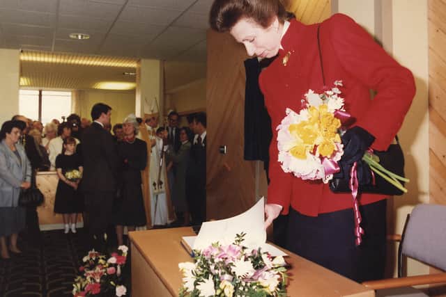 Princess Anne flicks through the visitors book after adding her signature at the official opening of Telford's new hospital in February, 1990, when it was renamed the Princess Royal Hospital