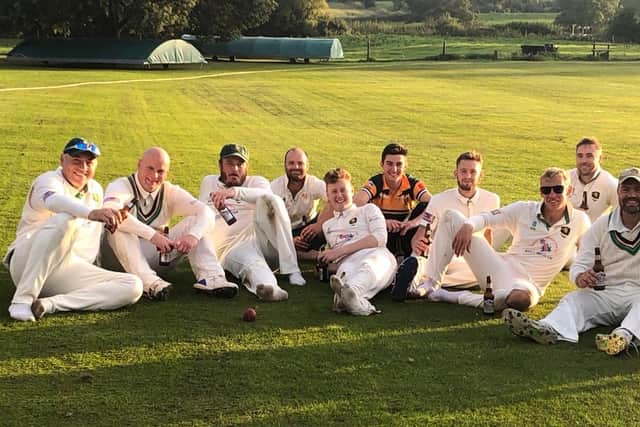 Eugene McCarney, second from right, and his teammates celebrate becoming Shropshire County Cricket League first division champions in 2019