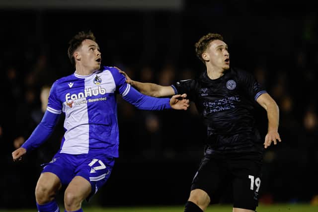 Iwan Morgan (right) of Shrewsbury Town was substituted after suffering a knock