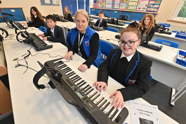 Music teacher Alison Ruston with students Tabatha Owen McDowall, Alexander Lim, Larisa Stefan, Keeva Gummery, Reuben Thomas and Sarah-Louise Leach. Photo: Steve Leath