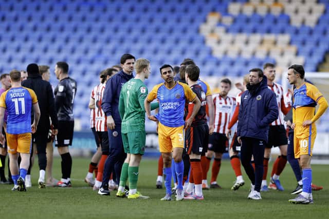 Mal Benning and his Shrewsbury Town team-mates at full-time