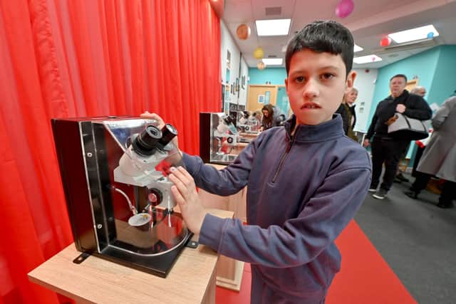 Howard Flood, aged nine, enjoys the art exhibition. Photo: Steve Leath