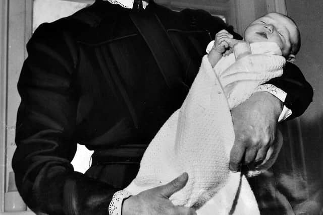January 1962: 'Keeping her hand in is the matron of Wrekin Hospital, Miss I Braithwaite, with one of the new 12 new born babies in the maternity ward.' 