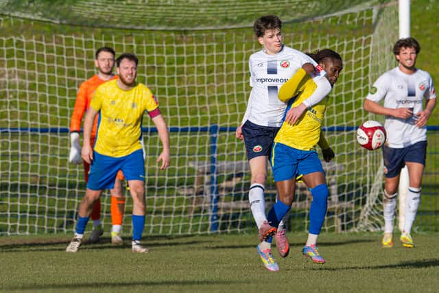 Shifnal's Alamu Abdulrasaq is restrained. Picture: Jim Wall