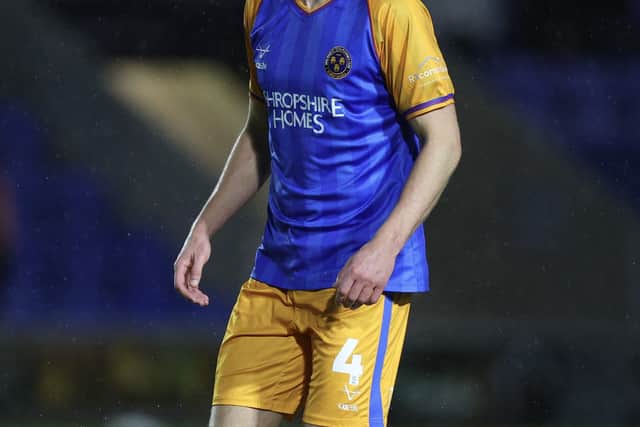 Shrewsbury Town’s Tom Anderson was forced off with a hip problem against Cheltenham Town