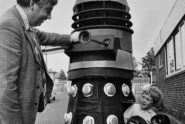May 22, 1978, the original caption reads: 'Pre-fete fun at St Patrick's Primary School, Wellington, yesterday. A working Dalek, made by people of the parish, had its first airing at the school in preparation for its official appearance at St Patrick's parish fete. Headmaster Mr John Carr is with (from left) five-year-olds Caroline Thomas, Christopher Reynold, and Jenny Lewis.'