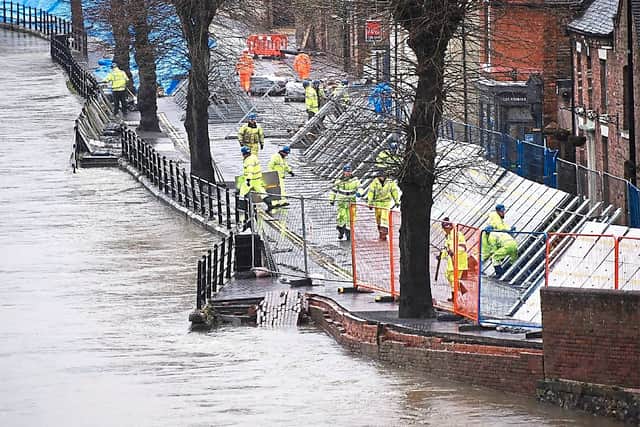 The flood barriers in Ironbridge had to be repaired after they were forced back by the water, gouging deep grooves in the road