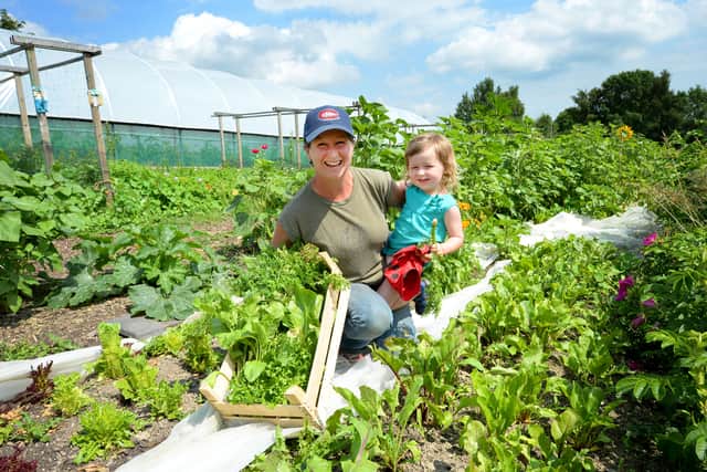 Daphne du Cros and her two-year-old daughter Isla at Little Woodbatch Farm near Bishop’s Castle