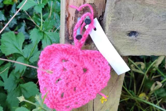 The crocheted hearts which have been appearing at sites around Telford, urging people to support local charities
