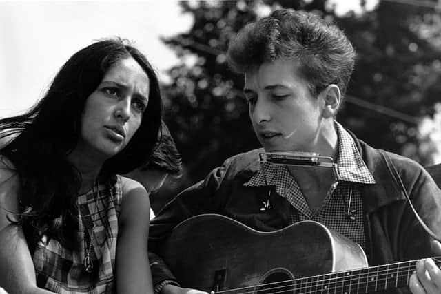 Joan Baez and Bob Dylan in the early 60s at Woodstock