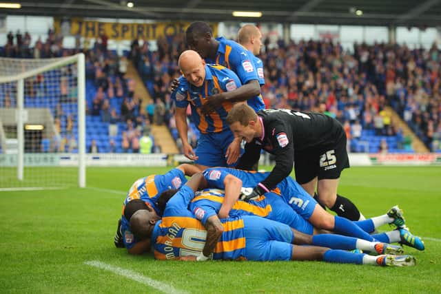 Nicky Wroe of Shrewsbury Town is congratulated by his team mates after scoring a goal to make it 2-0 (AMA)