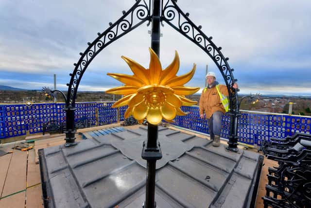 Carpenter Gareth Williams on top of the Flaxmill for the restoration of its coronet earlier this year.