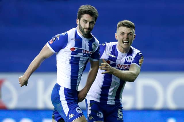 Will Grigg (left) celebrate (Martin Rickett/PA Wire)