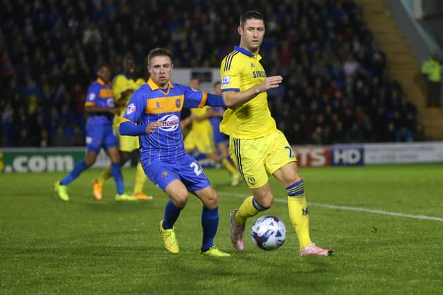 Jordan Clark of Shrewsbury Town and Gary Cahill of Chelsea. (AMA)