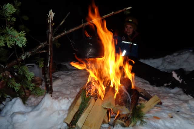 Round the campfire during snowshow trek