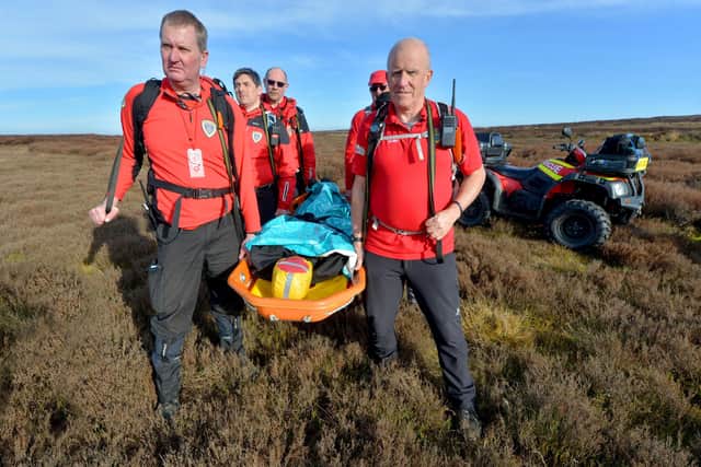Stuart Tyrer and Dave Brown lead the way as the volunteers from West Mercia Search and Rescue carry out their training exercises on the Long Mynd at Church Stretton