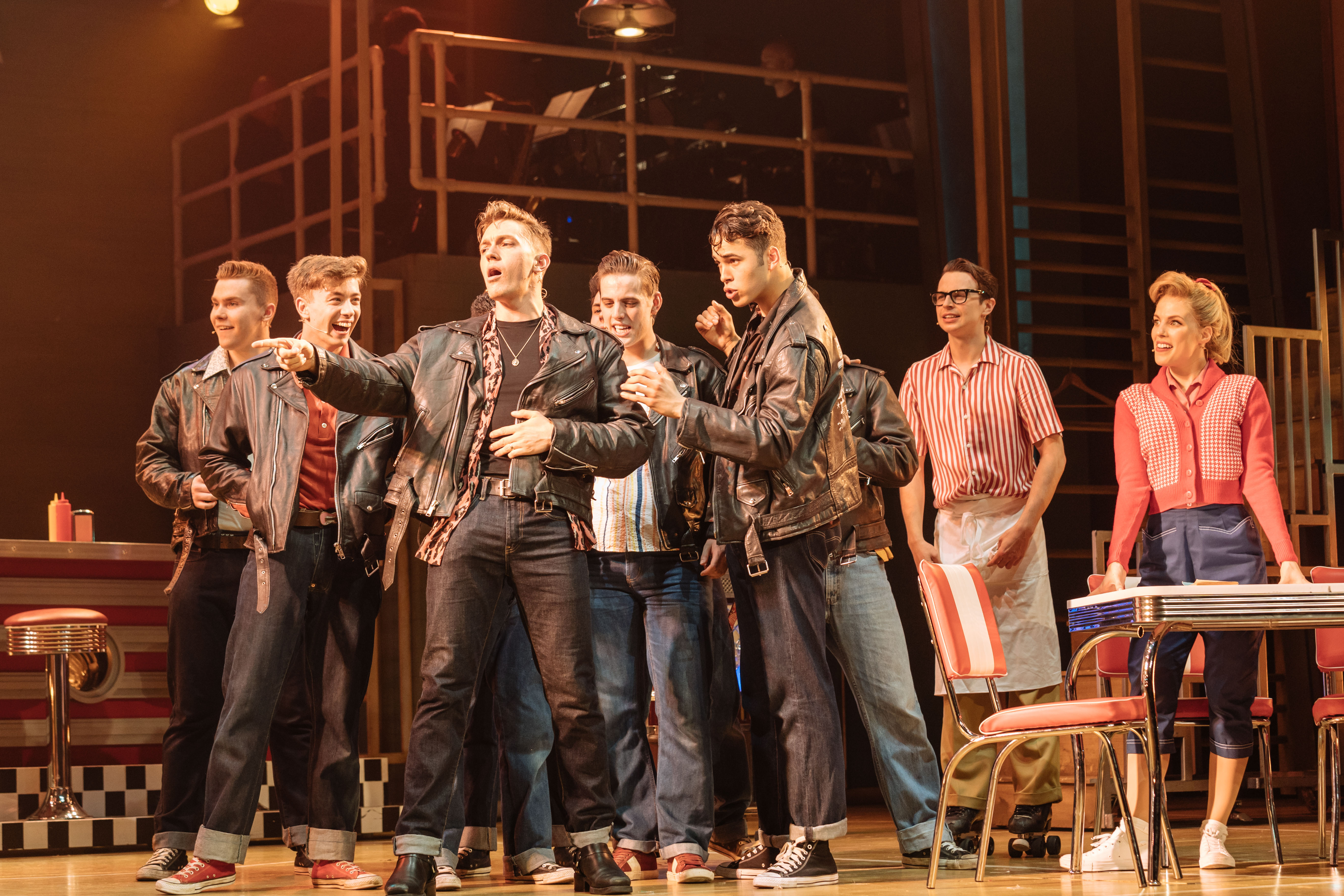 Dan Partridge as Danny & Louis Gaunt as Kenickie (front) and the T-Birds