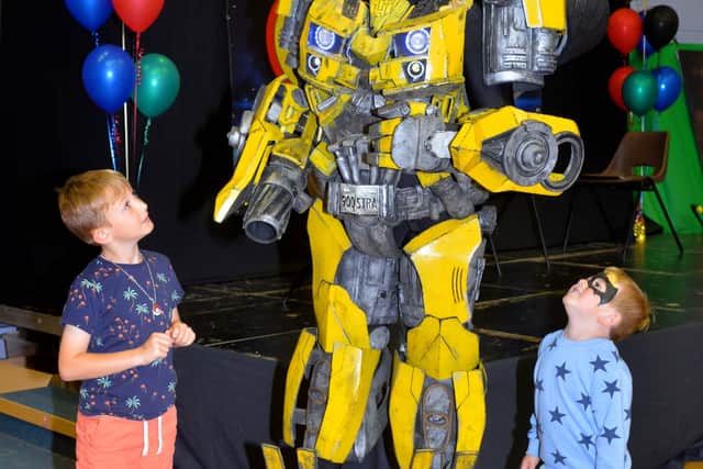 Cooper Tomlin, 7, and Artie Tomlin, 4, from Bristol saying hello to Bumblebee