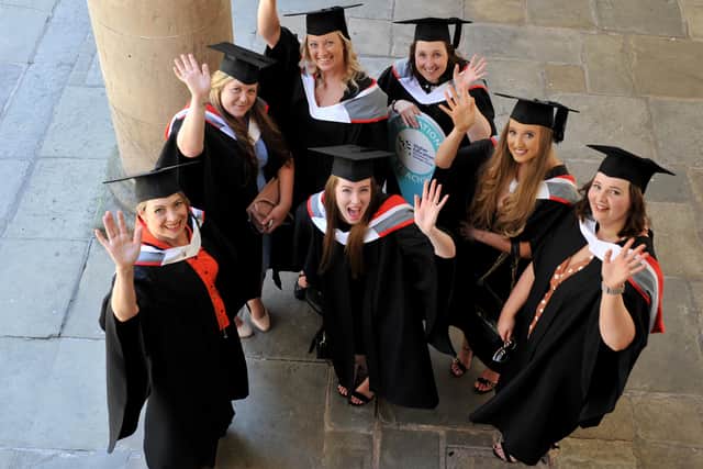 Delighted students celebrate outside the church