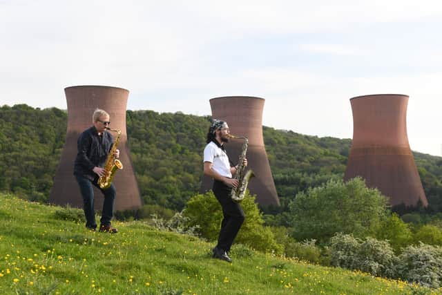 Musicians Ben Garrott and Jase Latham of The Modern Faces band playing it cool in front of Ironbridge Power Station cooling tower. Photo: David Bagnall Photography