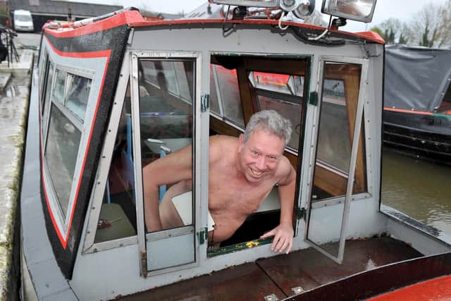 Naturist Mike greets passers by from on board The Shropshire Star canal boat