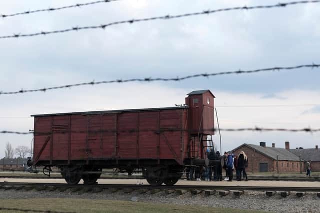 A sole carriage on the rail tracks at Auschwitz-Birkenau