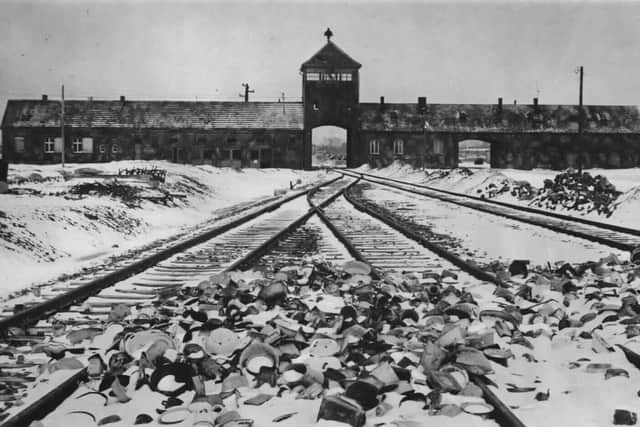 The gate tower, ramp and railway line at Auschwitz-Birkenau