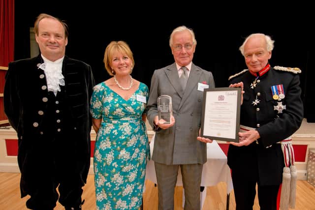 Presenting a Queen's Award for Voluntary Service to Church Stretton Good Neighbours