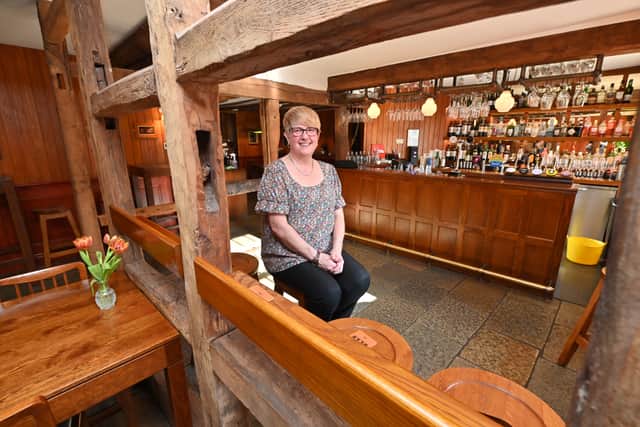 Manager Sharon Samuel sits inside the rustic bar. Photo: Steve Leath