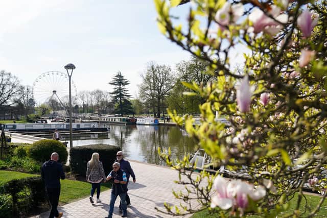 People walk during a bright morning in Stratford-upon-Avon, Warwickshire (Jacob King/PA)