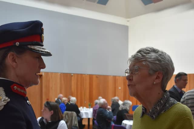 Presenting badge to a volunteer