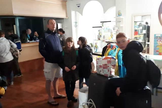 Pete Gough and his family wait to to be transferred to a new hotel