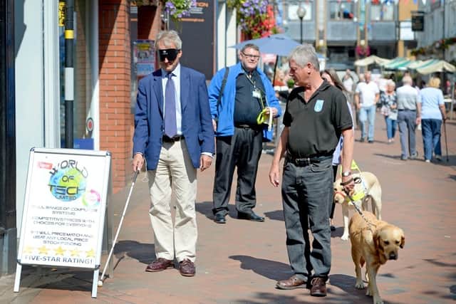 Owen Paterson walks blindfolded through Oswestry
