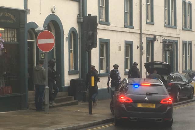 Both uniformed and plain-clothed officers were at the scene