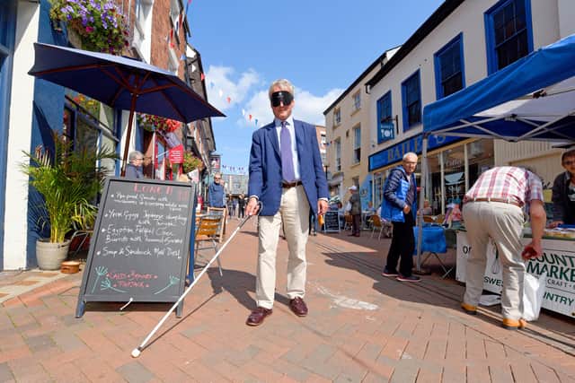 Owen Paterson walks blindfolded through Oswestry