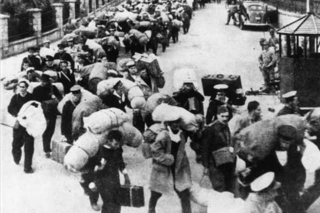 British prisoners being marched into captivity in Hong Kong in December 1941