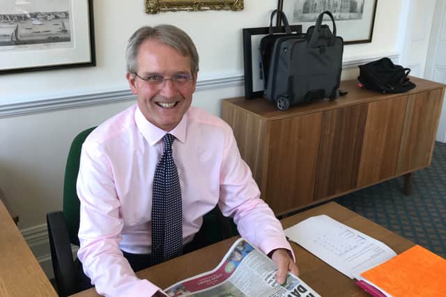 Owen Paterson is glad to be back catching up with the news behind his desk in Westminster