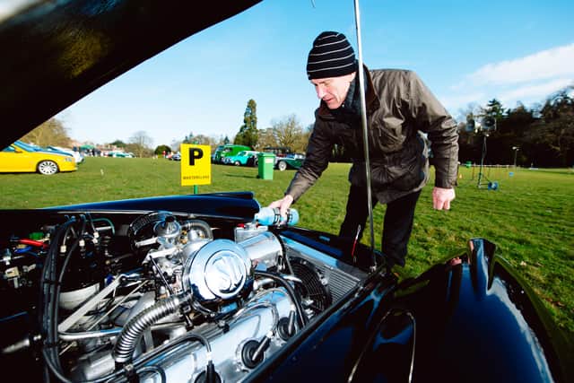 Motorfest 2018 at Weston Park...In Picture: Roy Watkiss from Stafford filling up his Daimler SP250 with screen wash.