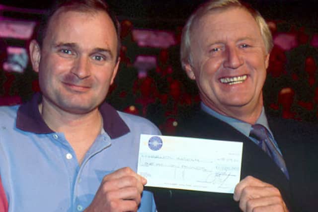 Charles Ingram presented with his £1 million cheque by Chris Tarrant