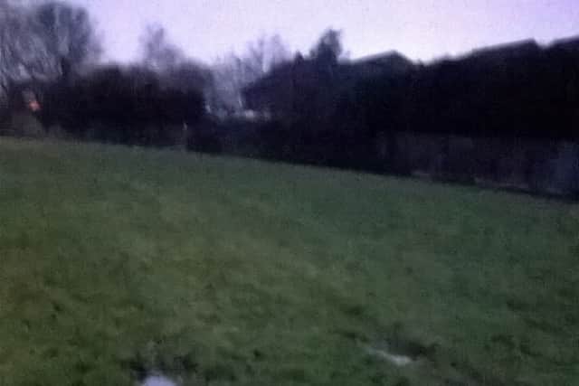 Muddy tracks caused by cars forced to drive over a grass verge at Brands Farm Way, Telford