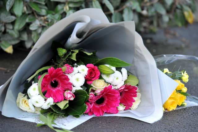 Flowers at the scene in Farmers Gate on Sunday morning