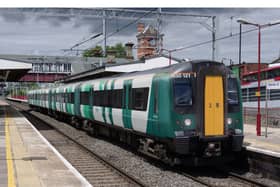 A London Northwestern train in green and white livery