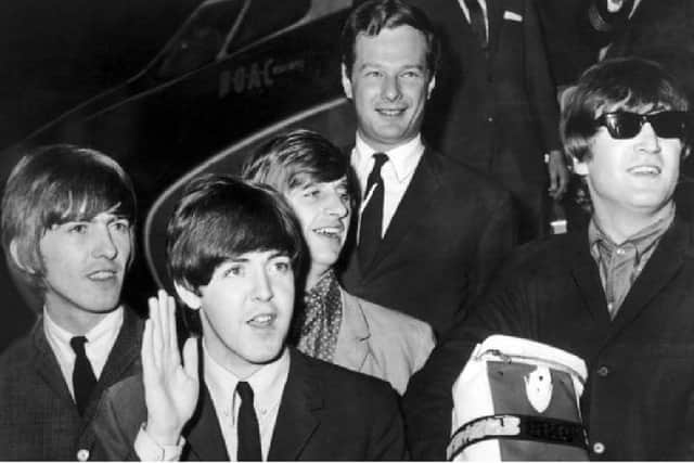 Brian Epstein, top, with The Beatles