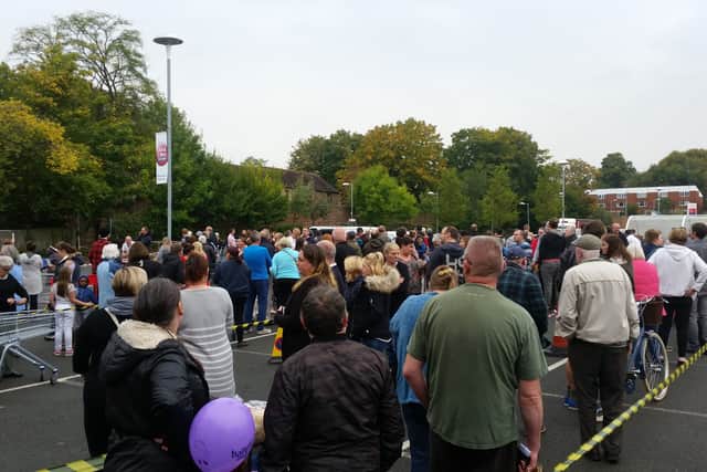 Crowds at Tesco car park in Madeley, where bottled water is being given out. Photo: Andy Silman