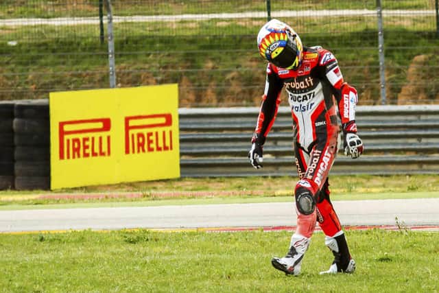 British motorcycle racer Chaz Davies walk to the boxers after his crash