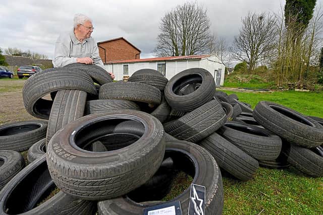 Mike Gatford with the dumped tyres