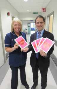 Sister Sharon Hollister, from Ward 17 at the Princess Royal Hospital in Telford, is presented with one of the cards by Dr Edwin Borman