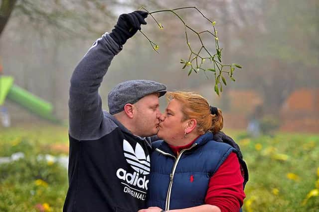 Wayne and Lisa Price from Shrewsbury test out the mistletoe