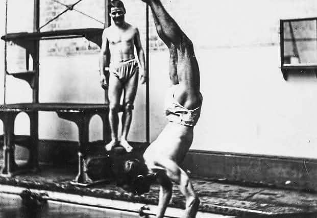Swimmers show off their diving skills at the pool
