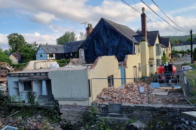 The demolition underway and the rest of the street.